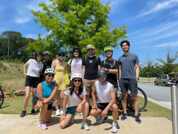 A group of employees getting ready to go on a bike tour