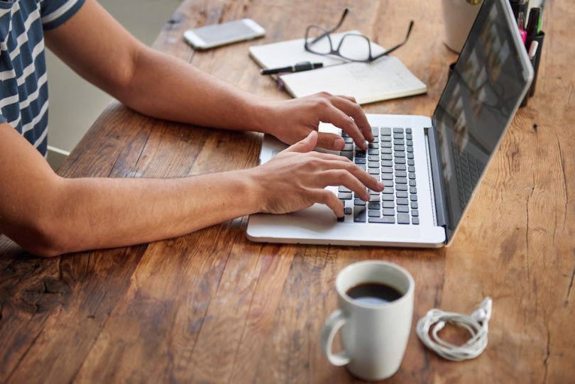 Person typing on laptop