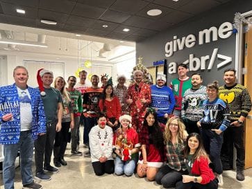 Our team members love to showing off their most festive looks at our annual holiday party