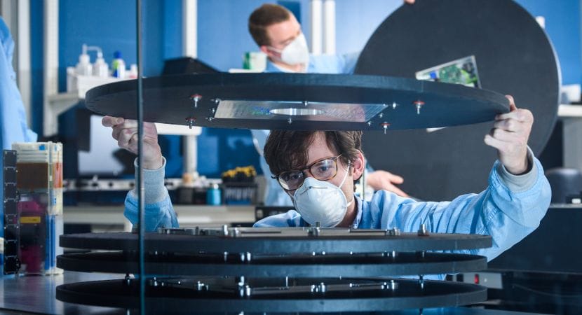 Aerospace Corporation researchers in the xLab assembling DiskSat