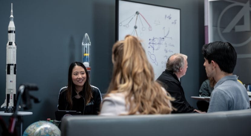 Aerospace Corporation employees discussing space in the Mathematics Lab