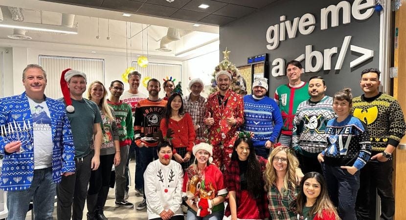 Our team members love to showing off their most festive looks at our annual holiday party