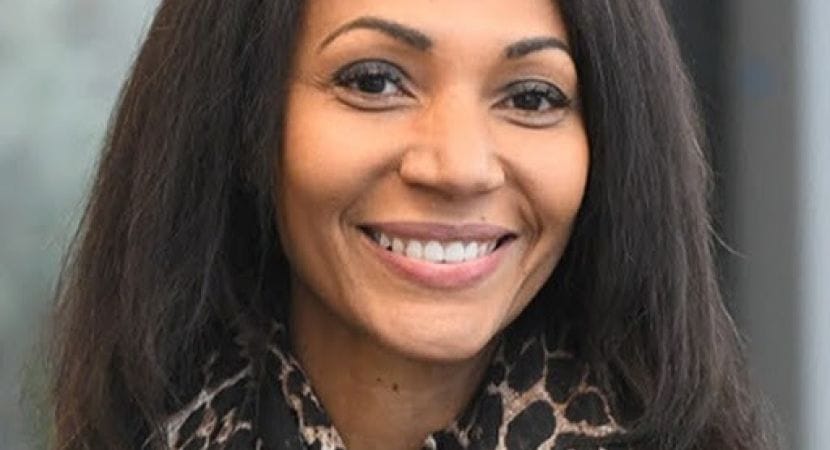 Yameogo-Stanzler wears a leopard-print scarf.