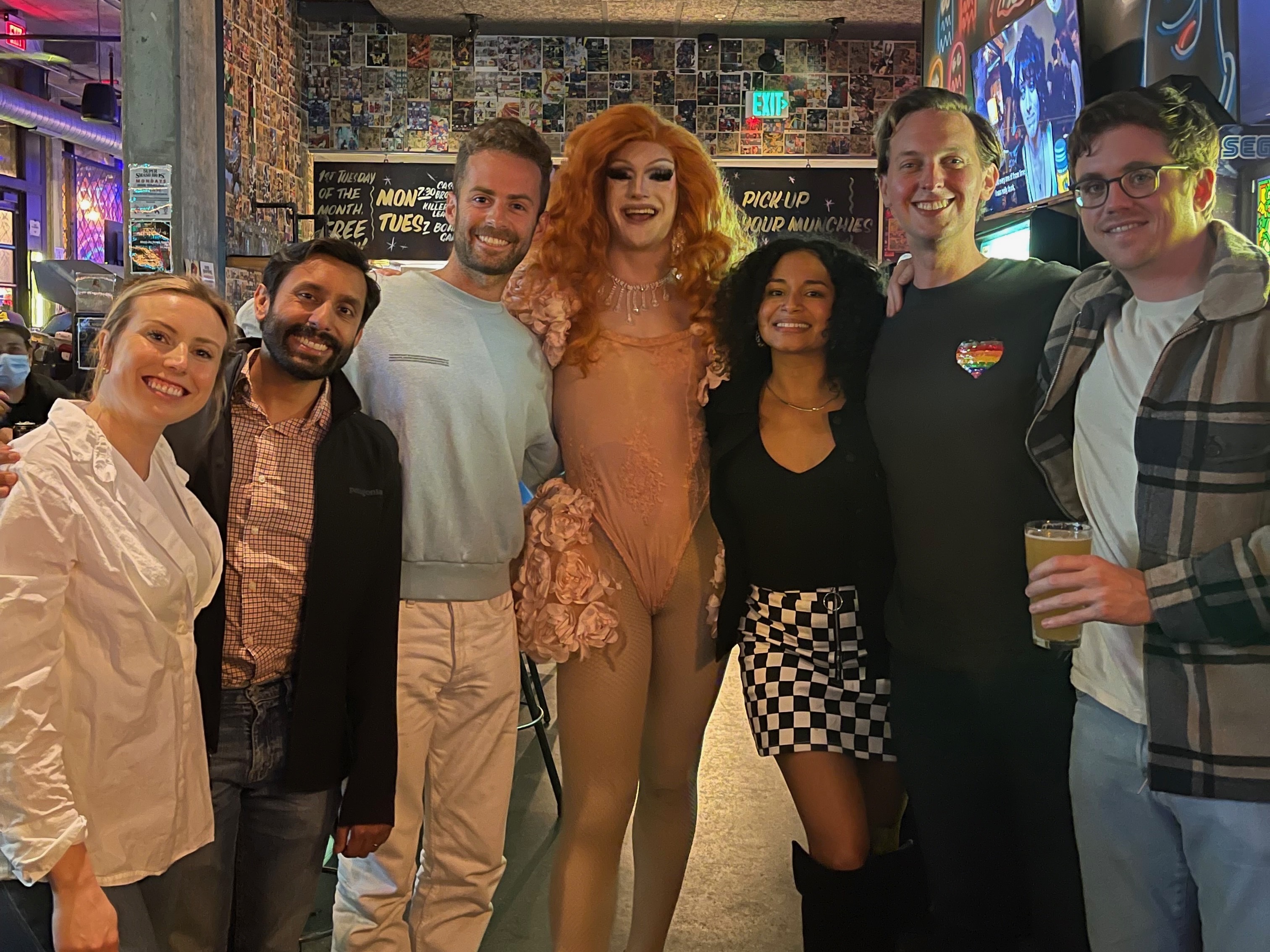 Celonis team members with game host at Drag Bingo event.