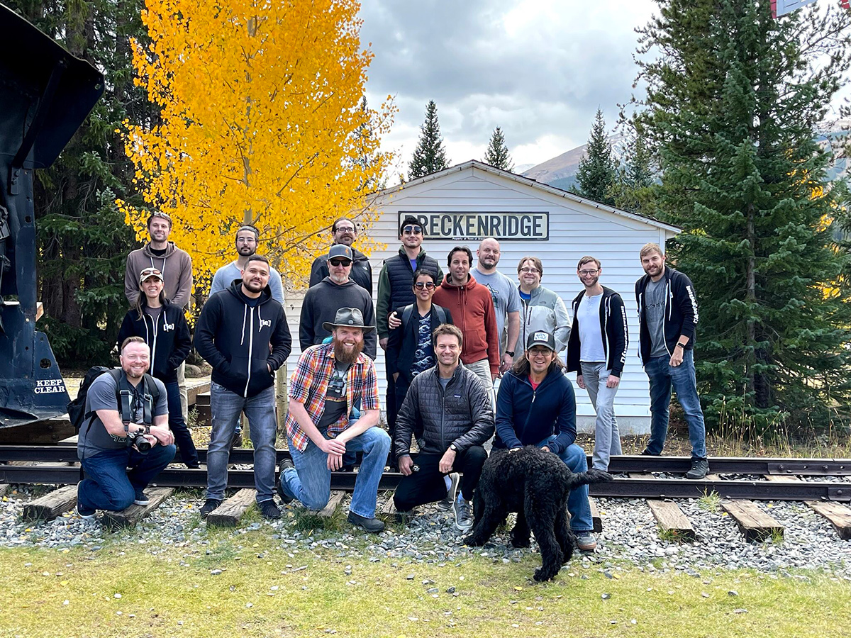 Artium group photo outside by railroad tracks