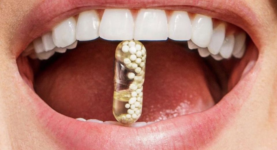 Ritual pill in mouth of woman
