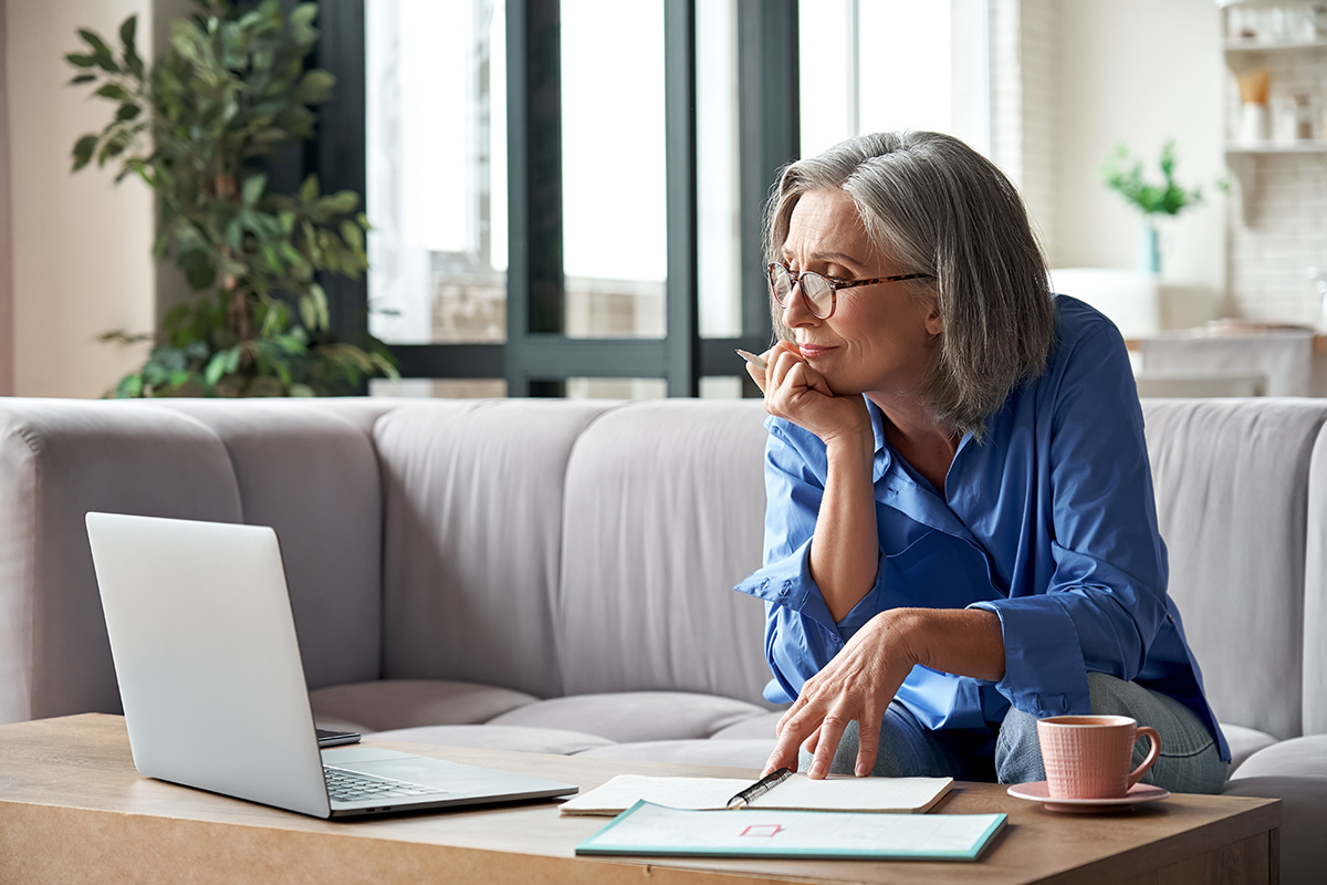 Woman at home having a video meeting on a laptop