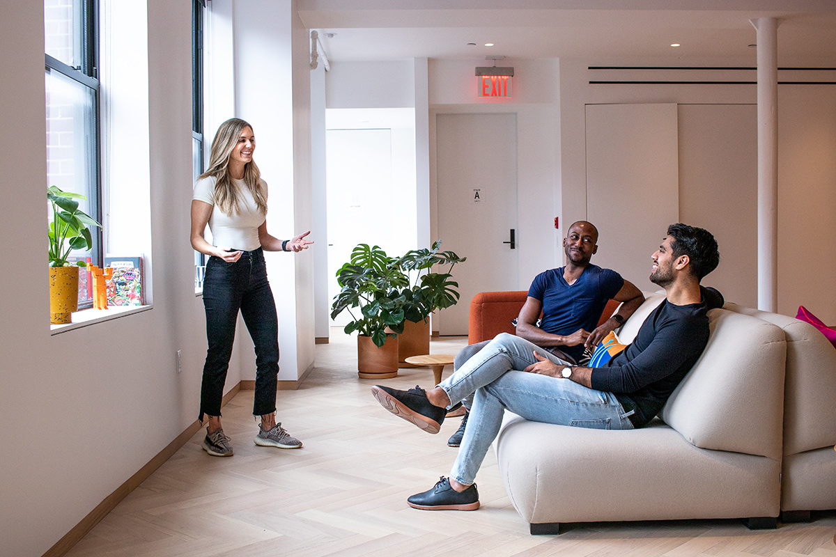 Cash App colleagues having a team huddle in the office