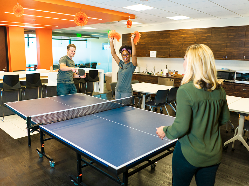 Forwardline employees play ping pong