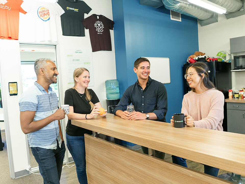 JEREMY SHAPERO in the office with his team