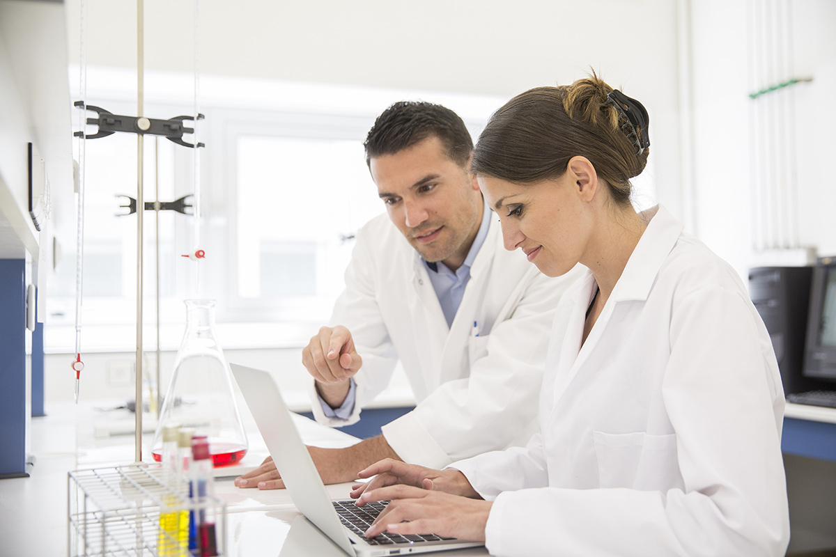 two scientists working together in a lab