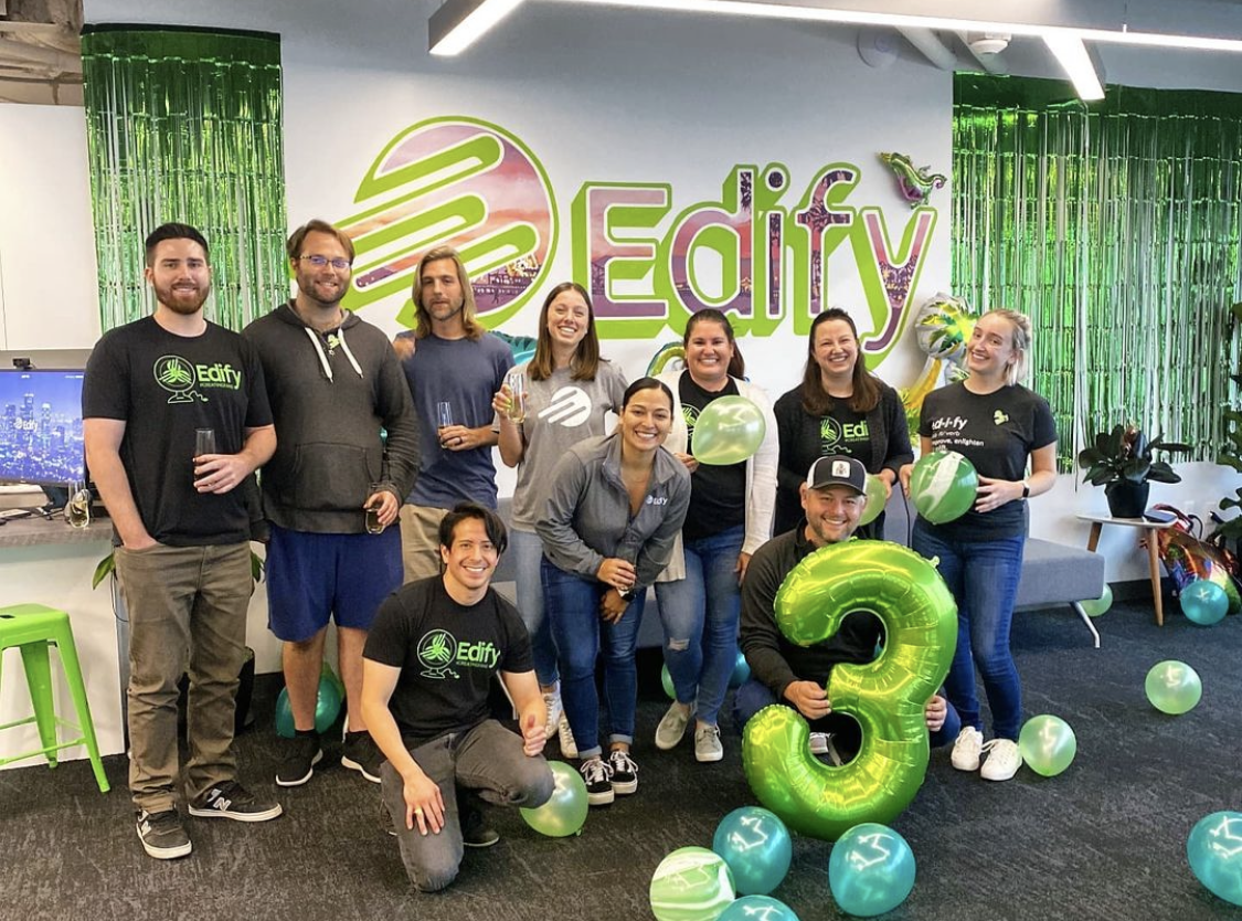 Edify team members celebrating the company's three year anniversary