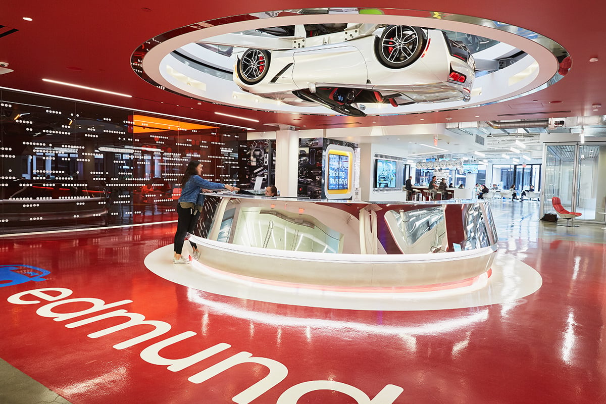 Inside of the Edmunds office with a car mounted to the ceiling