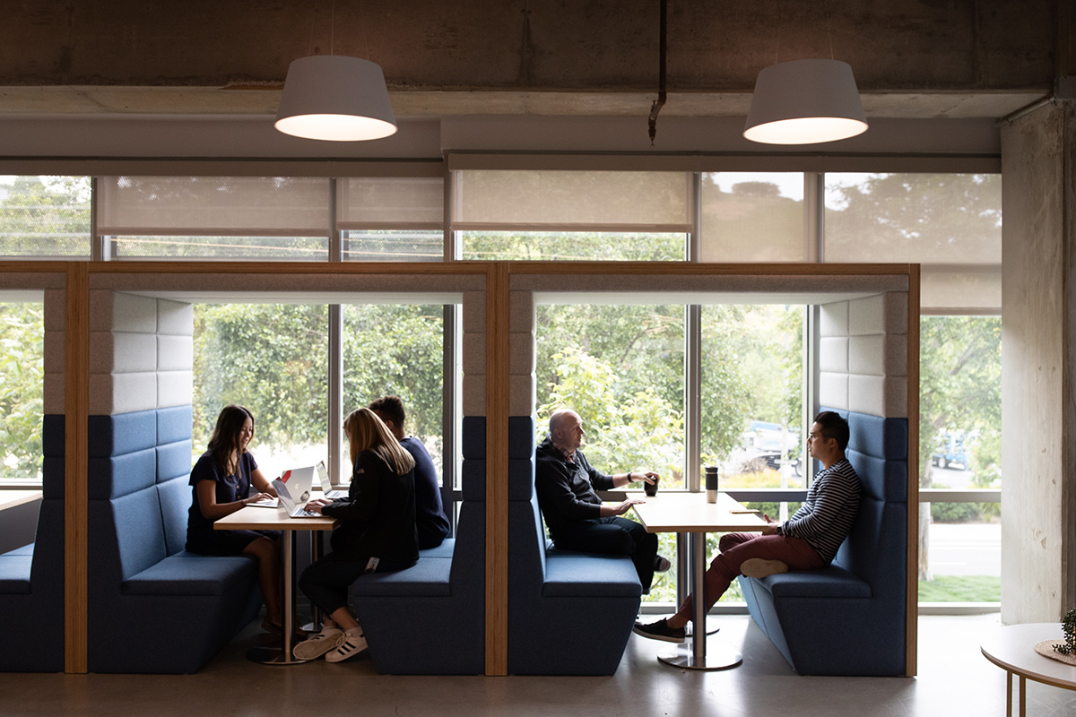 Flexport team members working in booths in the office