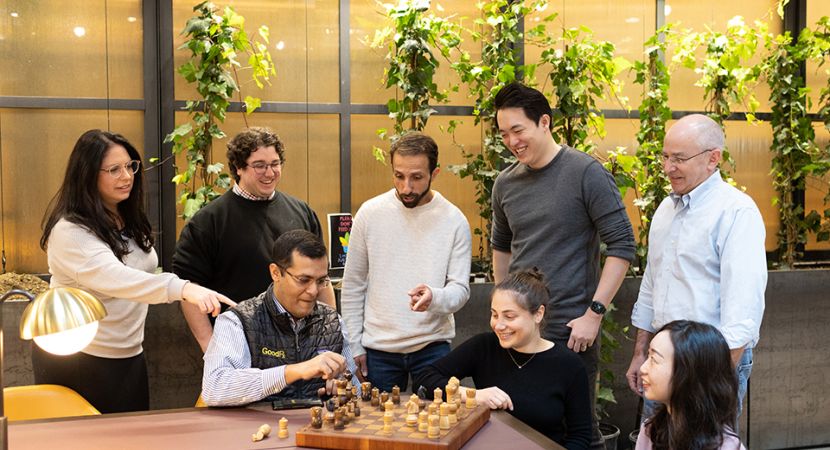 GoodRx team members playing a game of chess together.