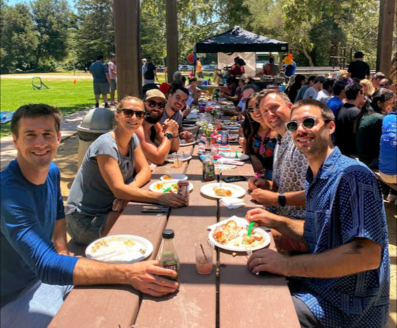HG Insights team members having a company picnic in a park