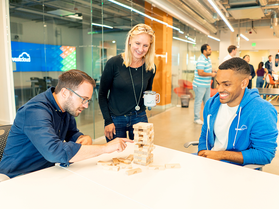 InvestCloud team playing Jenga