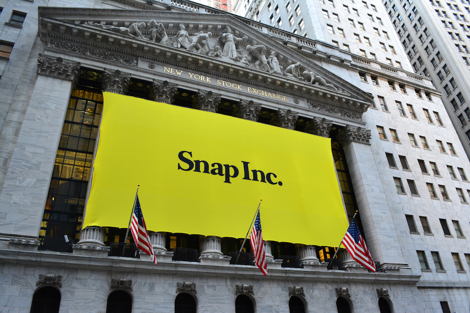 Snapchat banner over IPO ceremony in financial dstrict