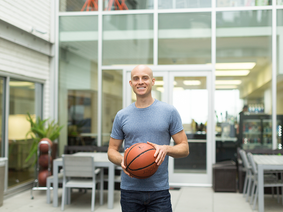Alex Ross of Tinder's engineering team shooting some hoops at the office