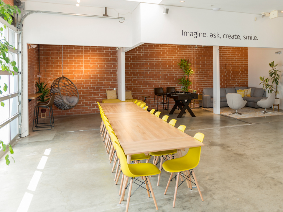 Earny's beautifully-designed office features bright pops of yellow