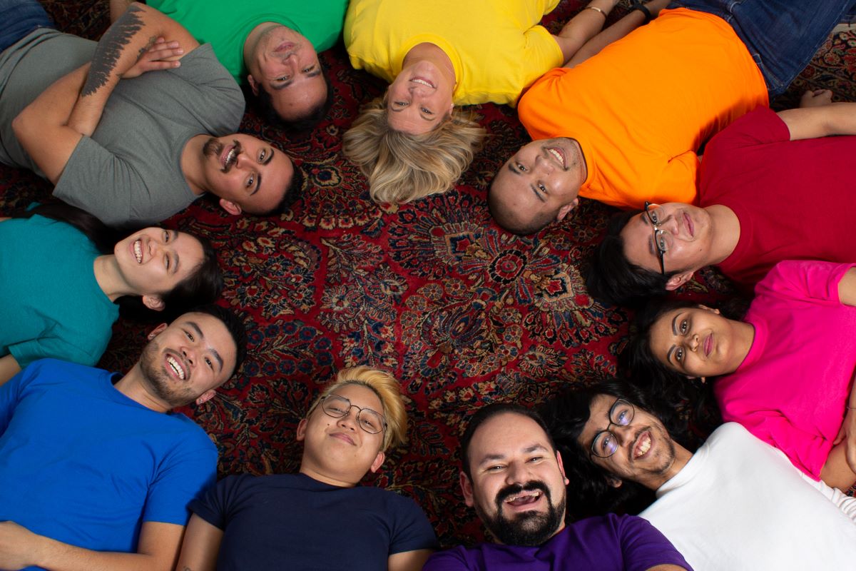 The Feedonomics' team lying on the floor in a circle
