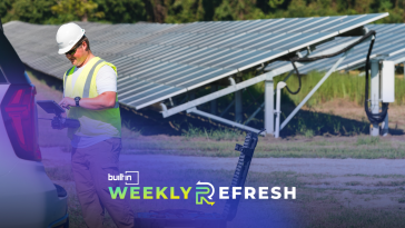 A Zeitview employee working on a job site near solar panels.