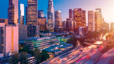 Downtown Los Angeles next to the expressway during sunset.