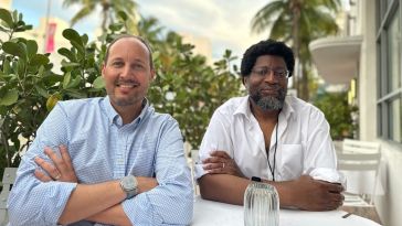 Azteco co-founders Paul Ferguson and Akin Fernandez pose together for a photo.