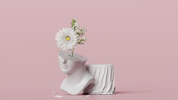  Bust sculpture with white flowers bouquet on a pastel pink background.