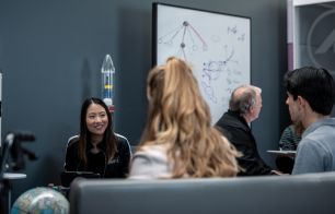 Aerospace Corporation employees discussing space in the Mathematics Lab
